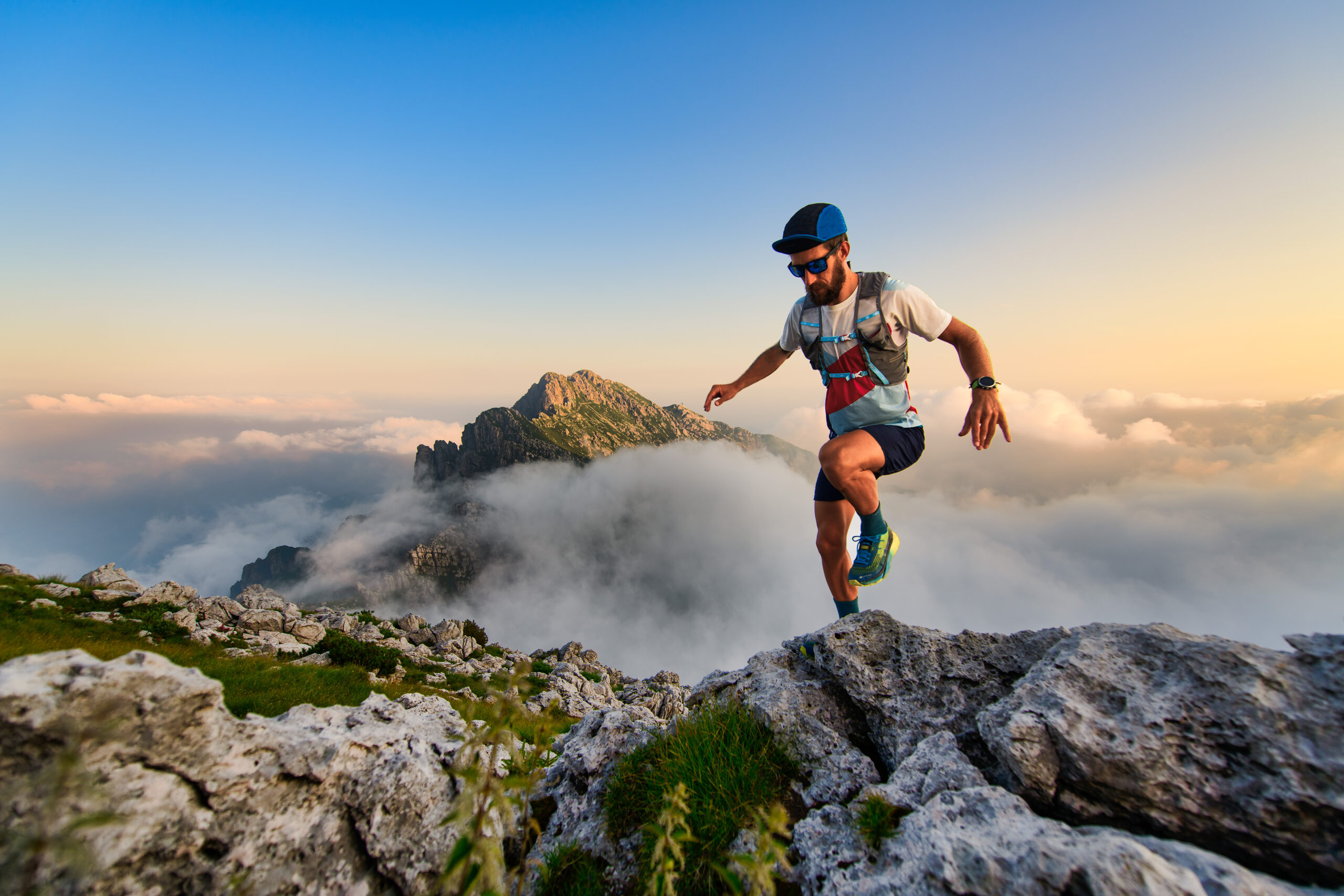 man,ultramarathon,runner,in,the,mountains,he,trains,at,sunset